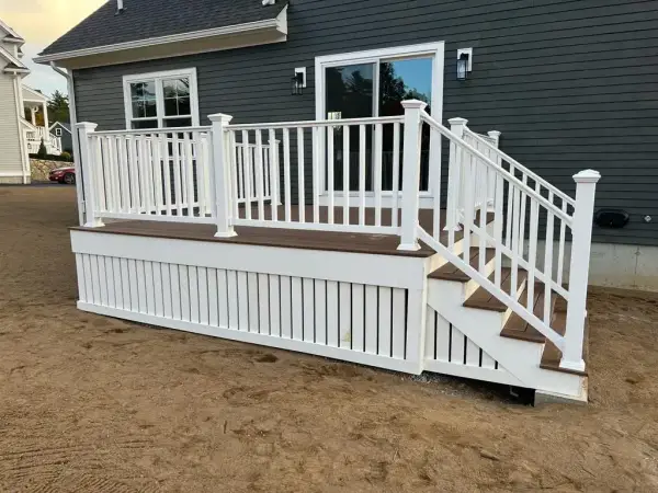 Close-up of integrated low-voltage LED step lights on a custom Wellesley deck