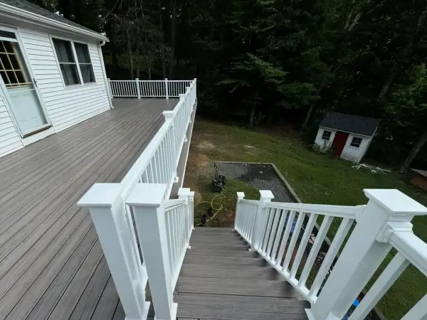 Elevated deck overlooking custom backyard patio built in Brookline, MA
